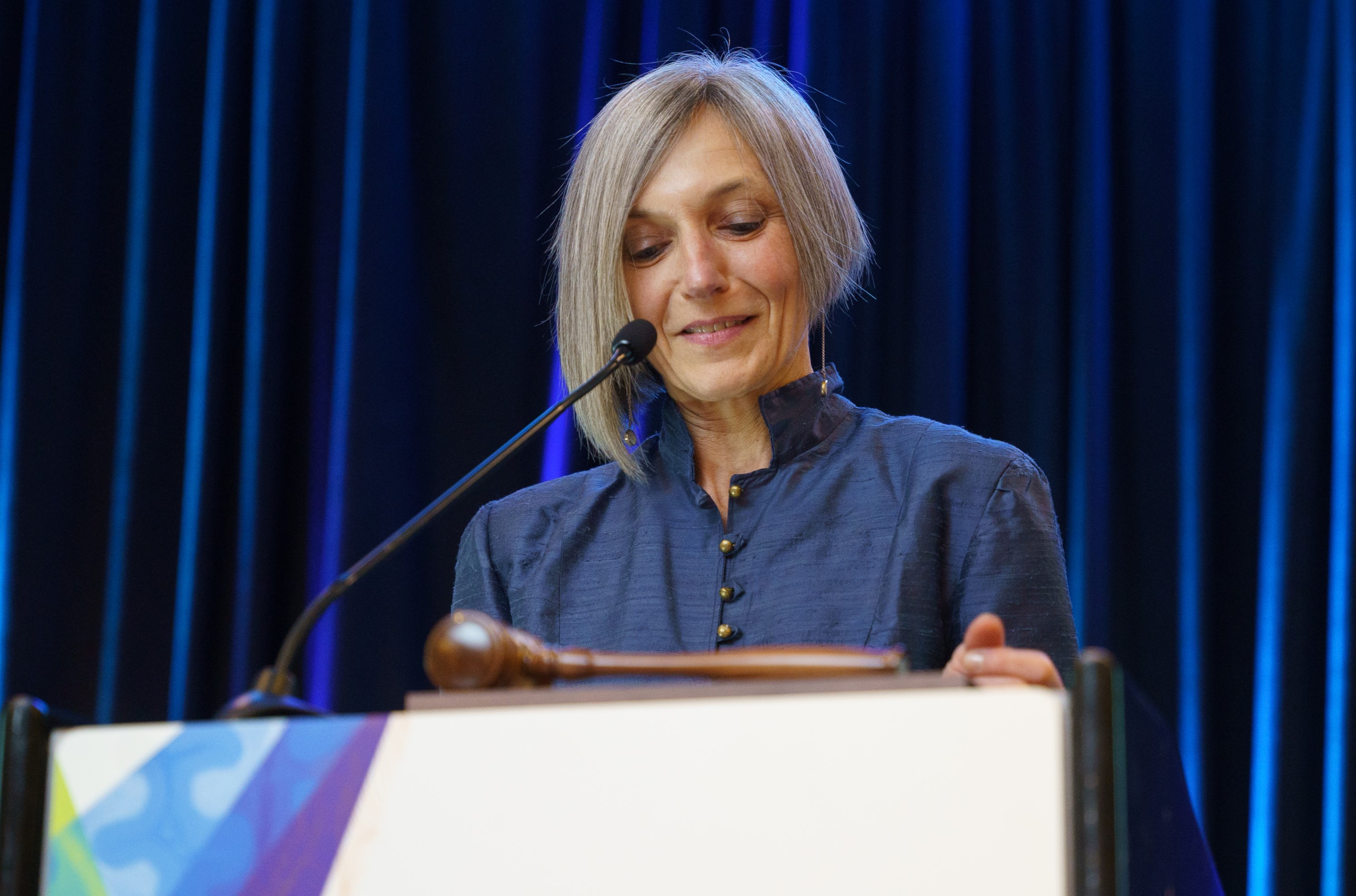 Martine Dunnwald speak at a podium