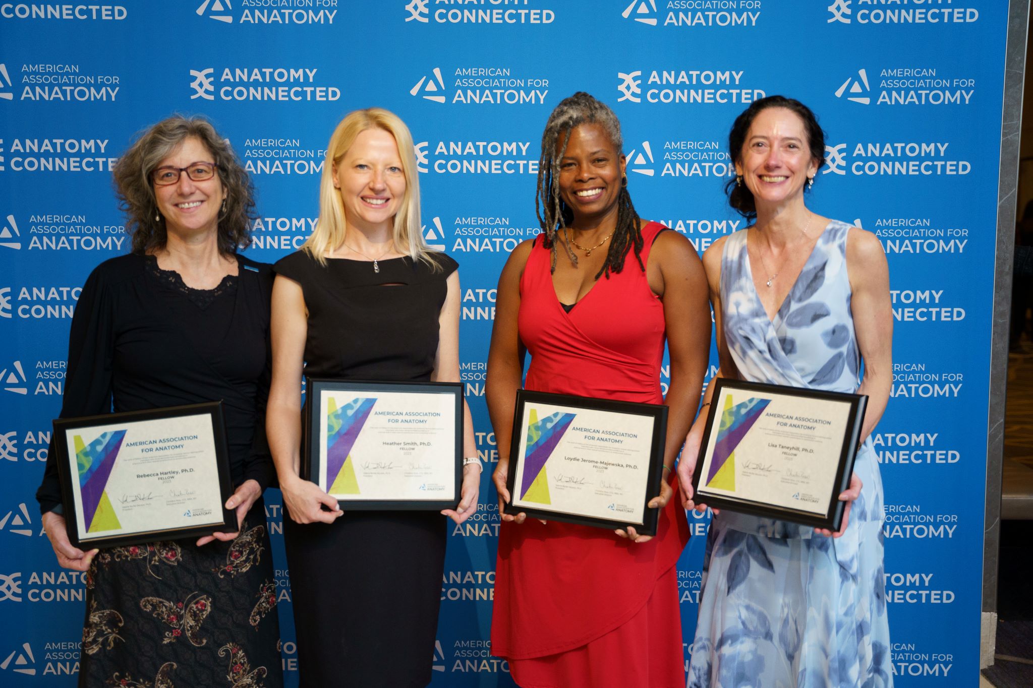 Rebecca Hartley, Heather Smith, Loydie Jerome-Majewska, and Lisa Taneyhill holding their awards
